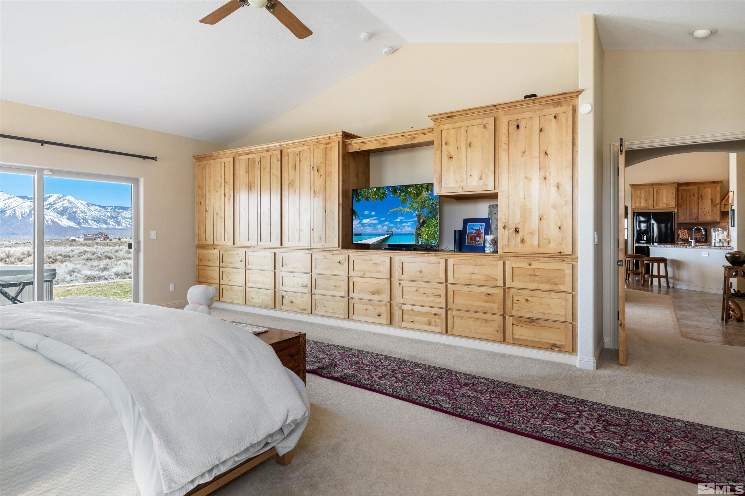 2428 Hasbita Lane Minden, NV 89423 - Photo 18 of 33 a bedroom with a bed a dresser and next to a window