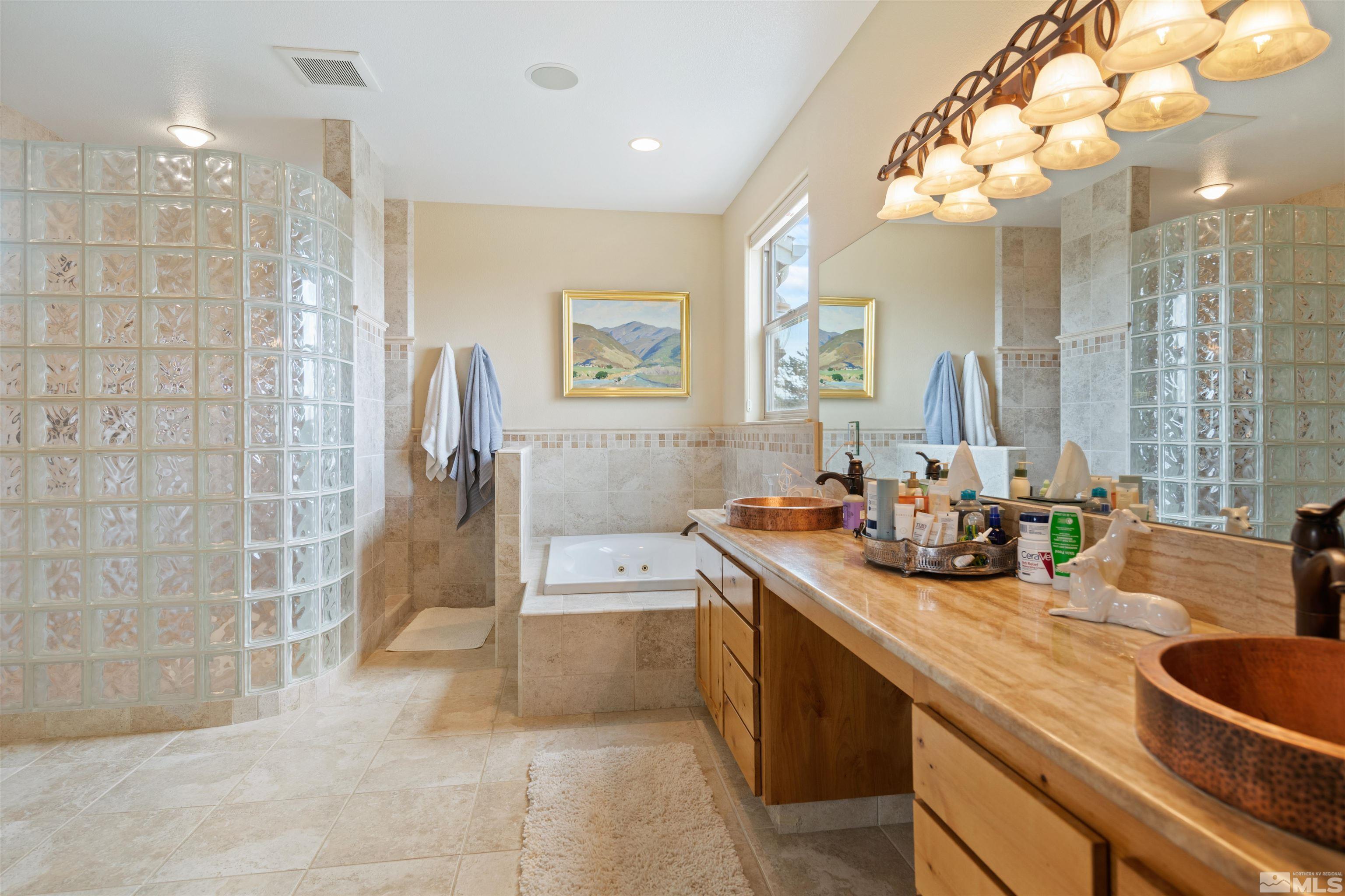 2428 Hasbita Lane Minden, NV 89423 - Photo 19 of 33 a bathroom with double vanity and a mirror