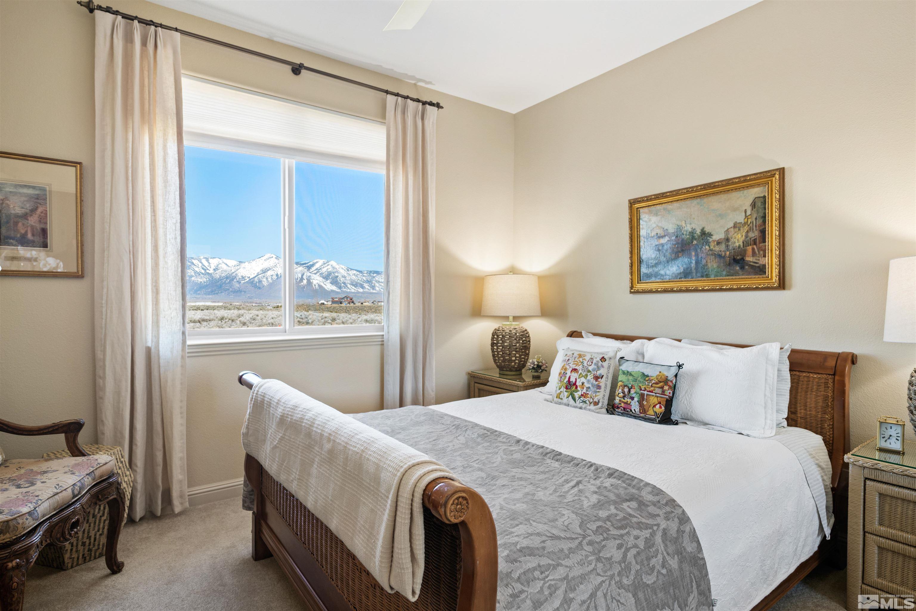 2428 Hasbita Lane Minden, NV 89423 - Photo 24 of 33 a bedroom with a bed and a painting on the wall