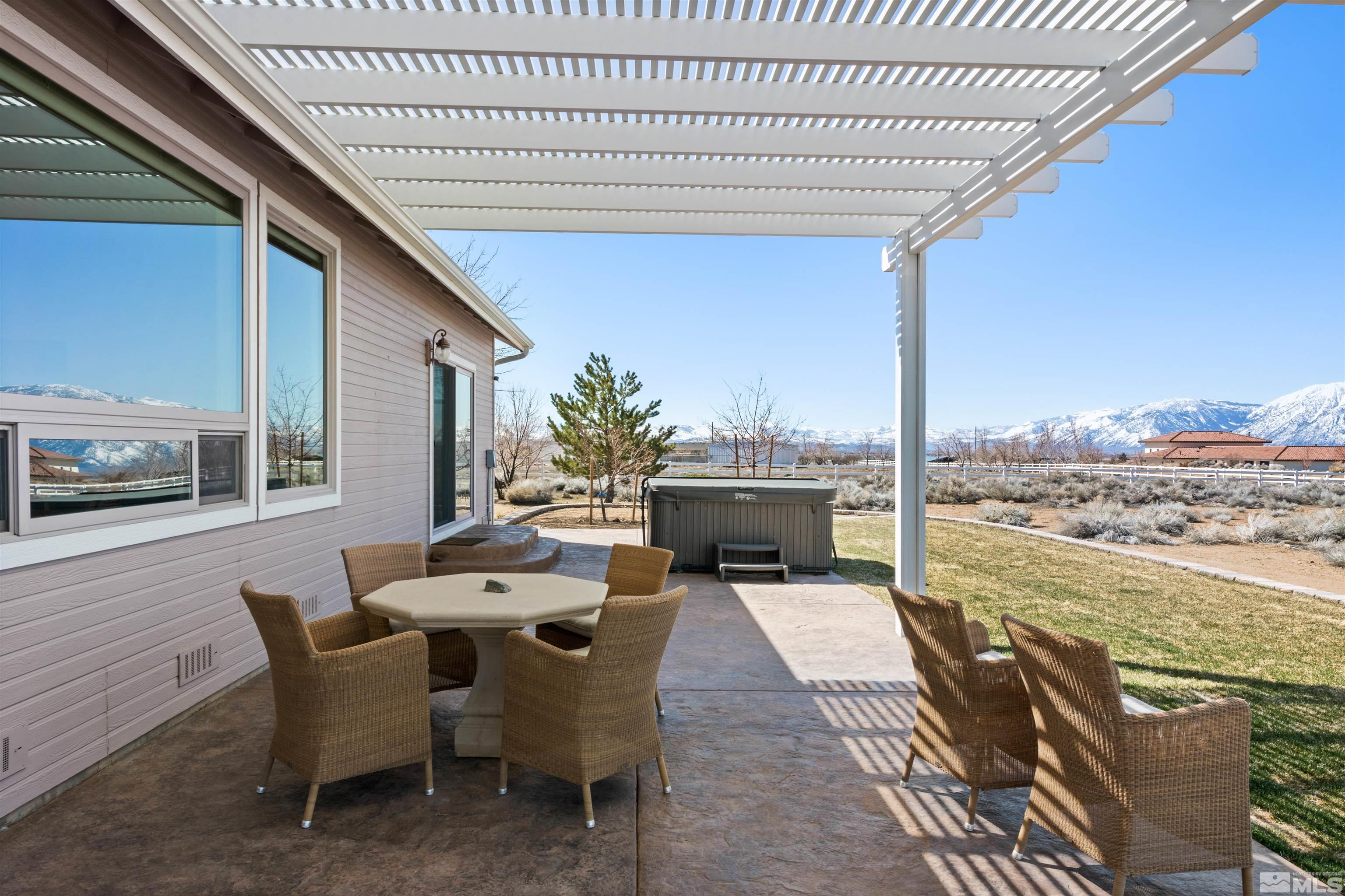 2428 Hasbita Lane Minden, NV 89423 - Photo 33 of 33 a dining room with furniture and a floor to ceiling window