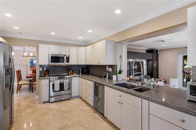 a living room with furniture ceiling fan and a rug