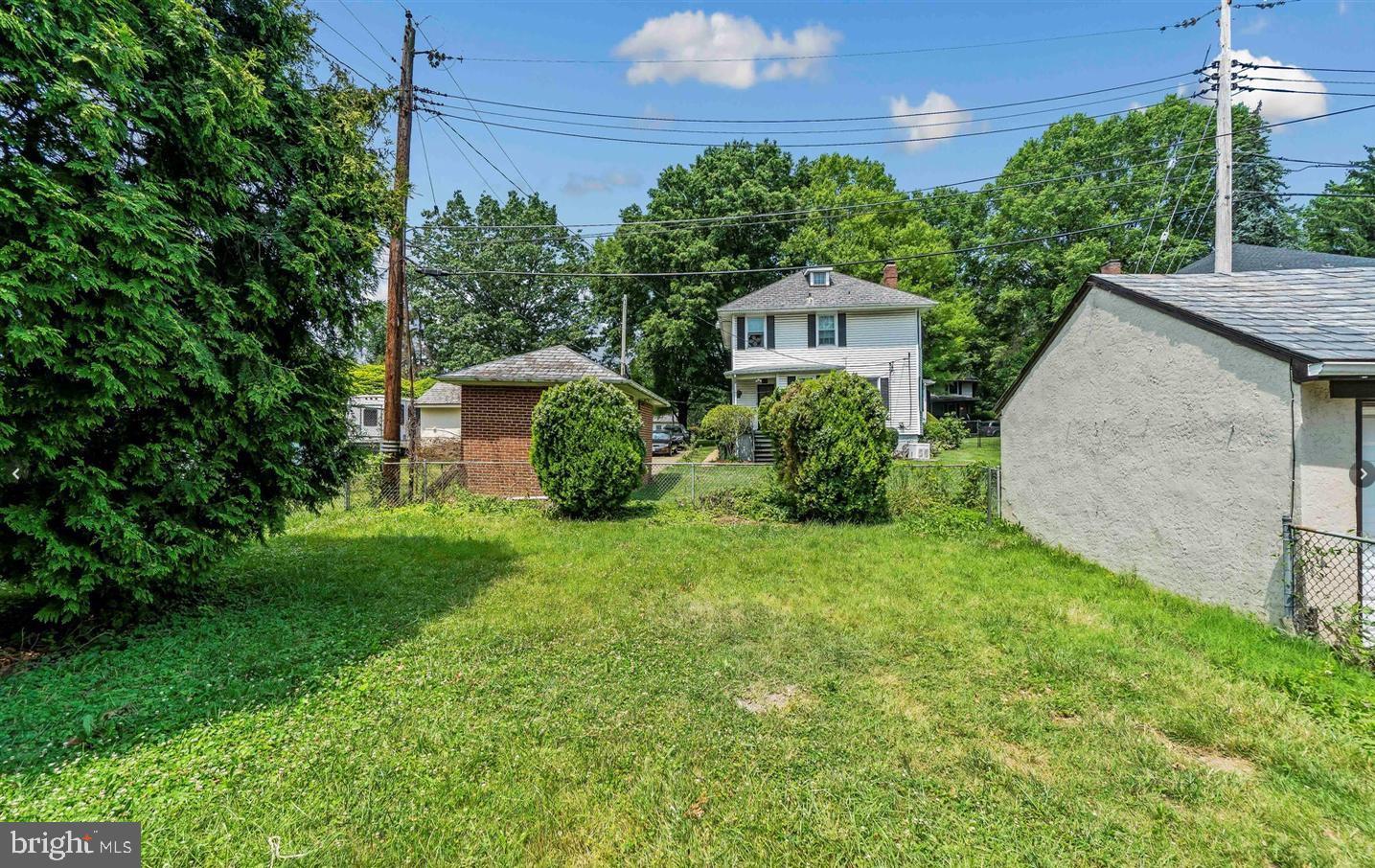 3400 Dennlyn Road Baltimore, MD 21215 - Photo 32 of 32 Spacious backyard with lush greenery.