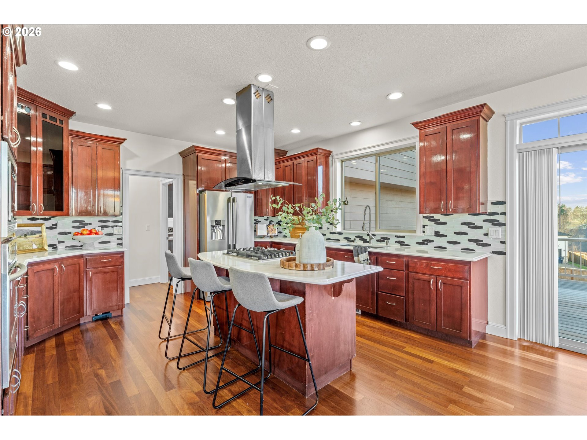 1727 Northwest Ogden Street Camas, WA 98607 - Photo 13 of 48 a view of kitchen with stainless steel appliances kitchen island granite countertop a sink and cabinets