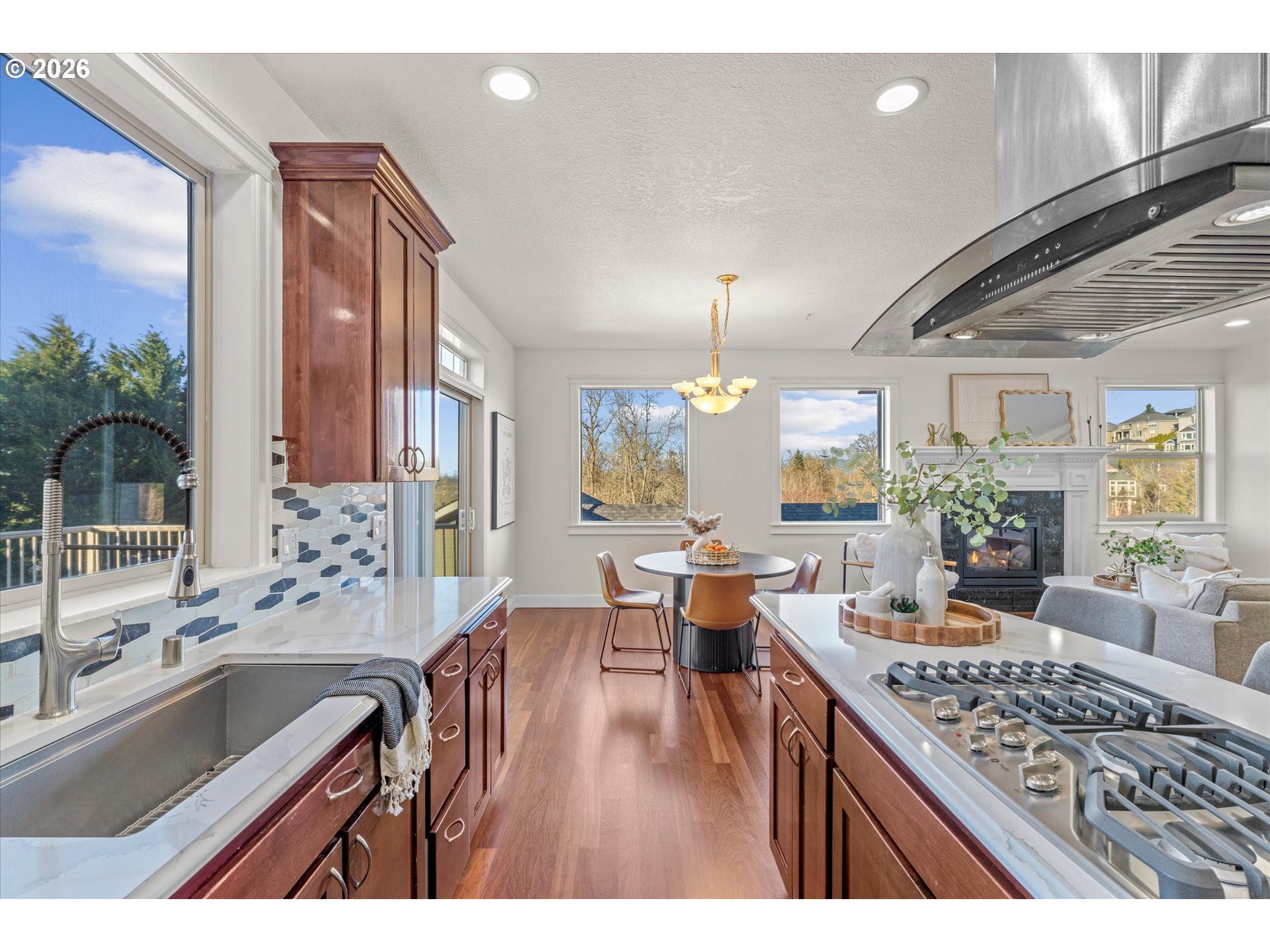 1727 Northwest Ogden Street Camas, WA 98607 - Photo 14 of 48 a open kitchen with center island a stove and a wooden floors