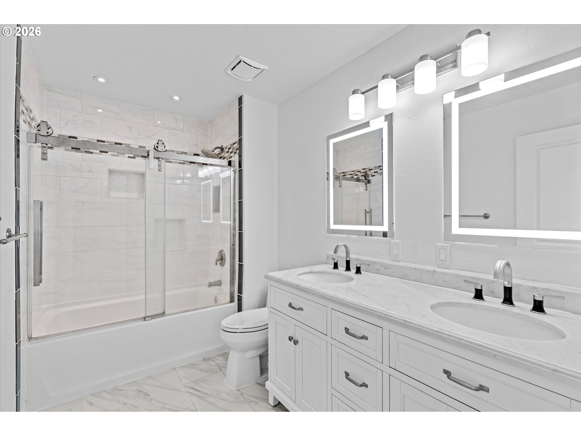 1727 Northwest Ogden Street Camas, WA 98607 - Photo 26 of 48 a bathroom with a double vanity sink toilet mirror and shower