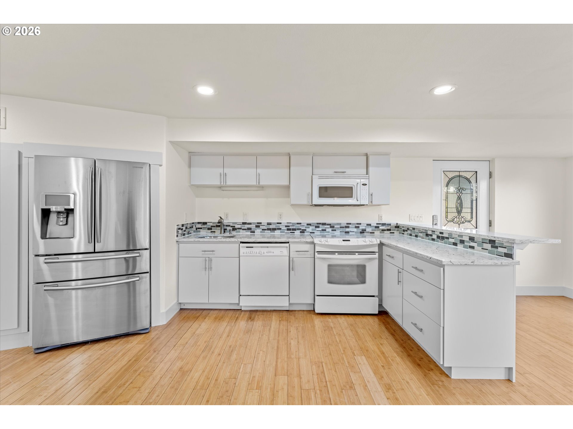 1727 Northwest Ogden Street Camas, WA 98607 - Photo 36 of 48 a kitchen with stainless steel appliances granite countertop a refrigerator and a stove top oven