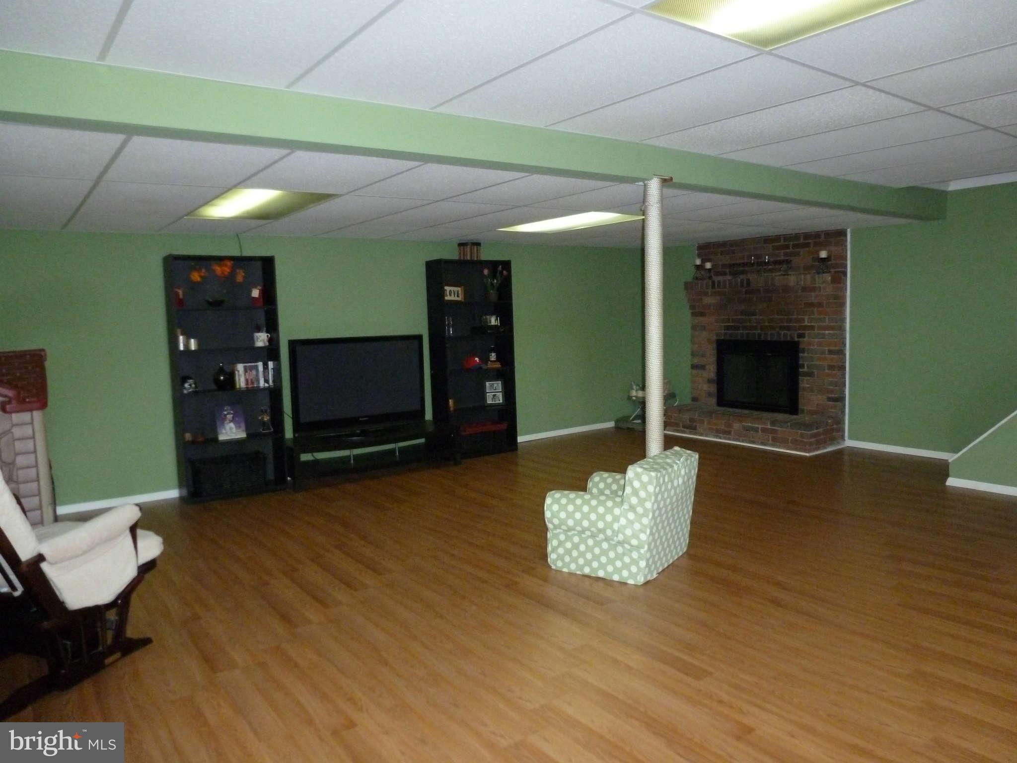621 Cleveland Road Linthicum Heights, MD 21090 - Photo 16 of 30 Rec room with fireplace