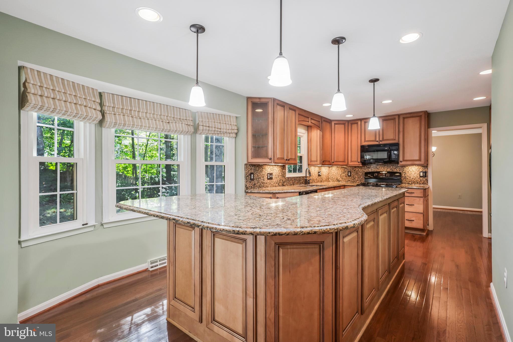 8711 Shadowlake Way Springfield, VA 22153 - Photo 13 of 49 Oversized island with Granite countertops