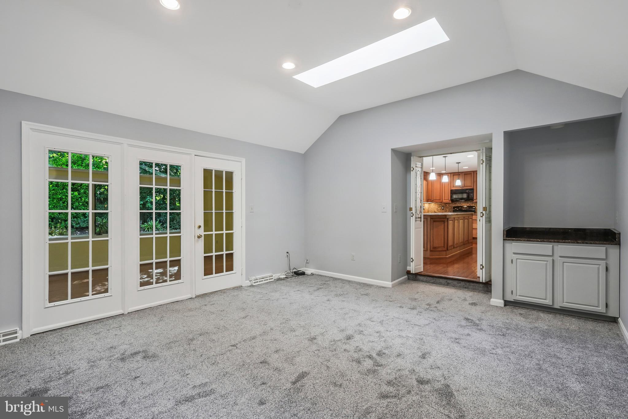 8711 Shadowlake Way Springfield, VA 22153 - Photo 17 of 49 Vaulted ceilings & glass doors lead to the sunroom