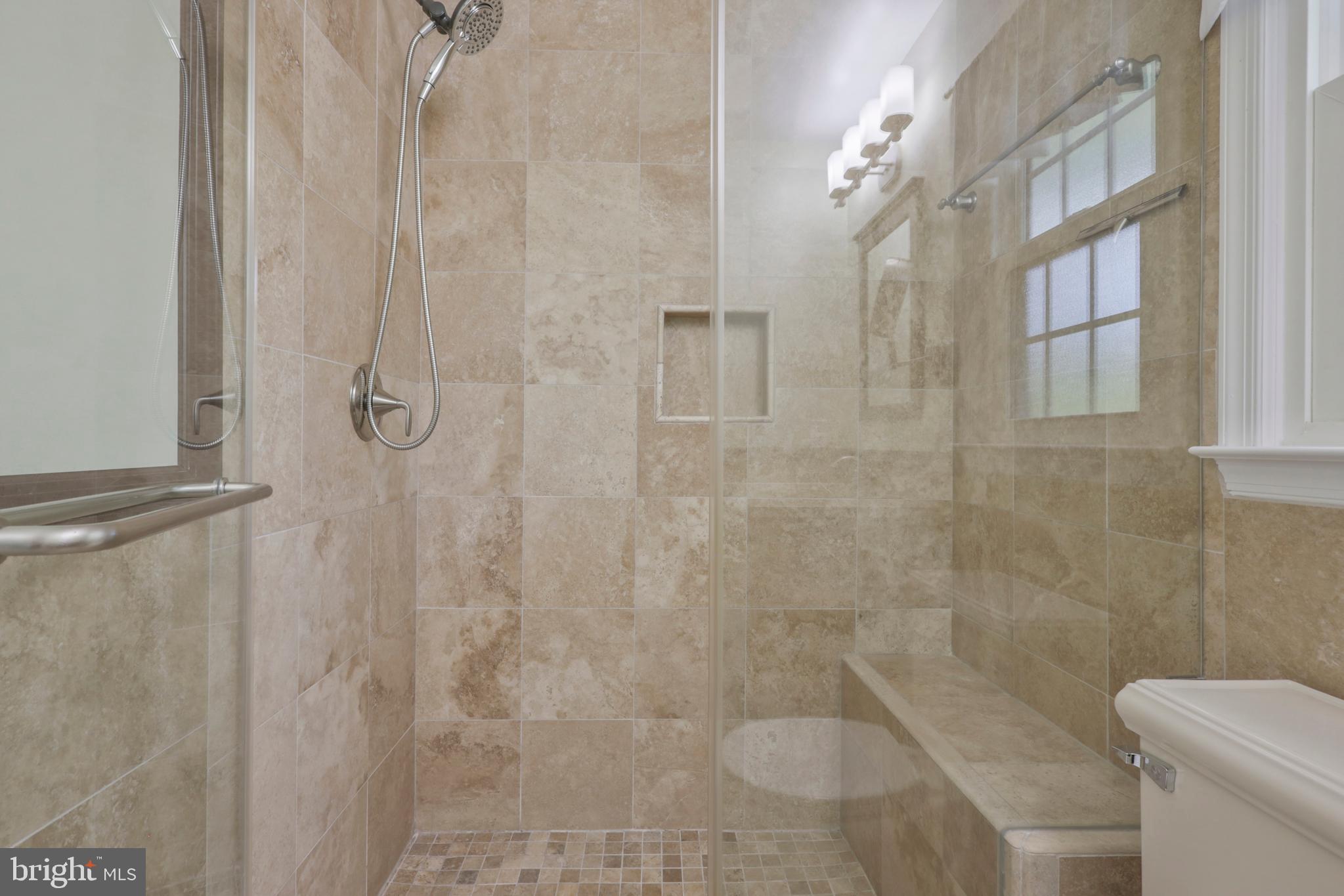 8711 Shadowlake Way Springfield, VA 22153 - Photo 25 of 49 Oversized shower with built in bench & glass doors