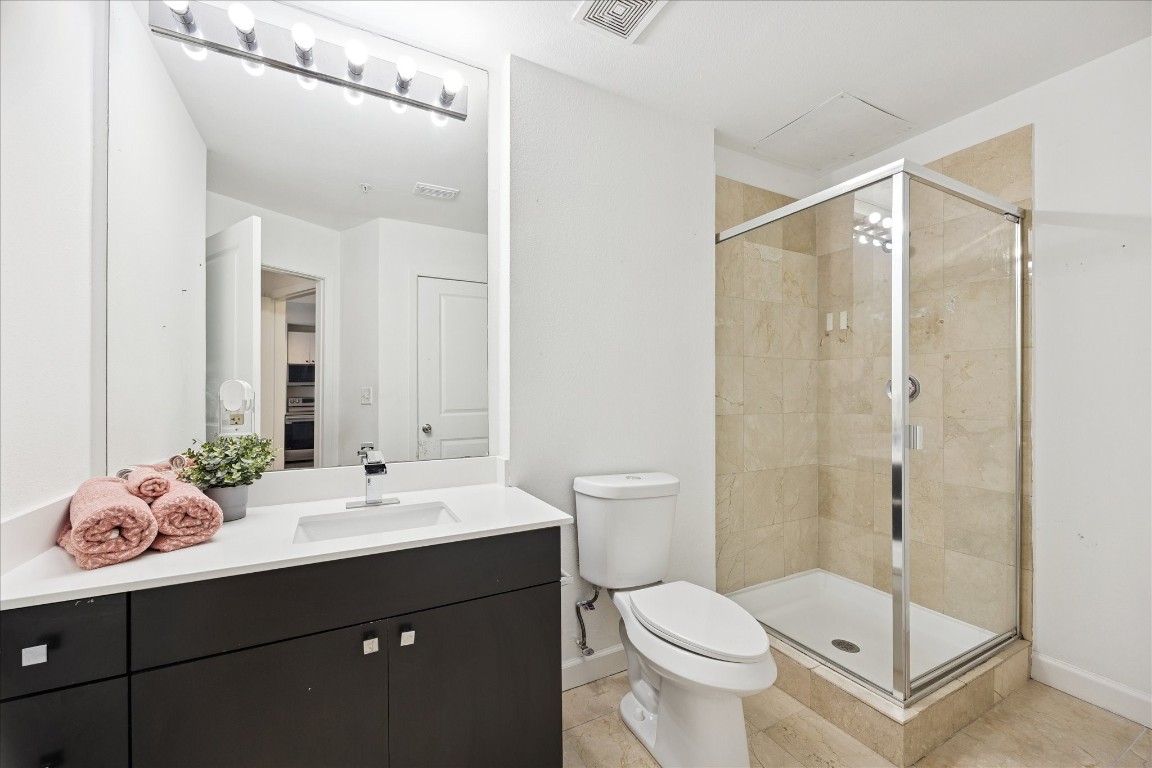 3505 Sage Road, Unit 1106 Houston, TX 77056 - Photo 14 of 22 Updated fixtures add a polished touch, complementing the clean lines and sophisticated finishes.