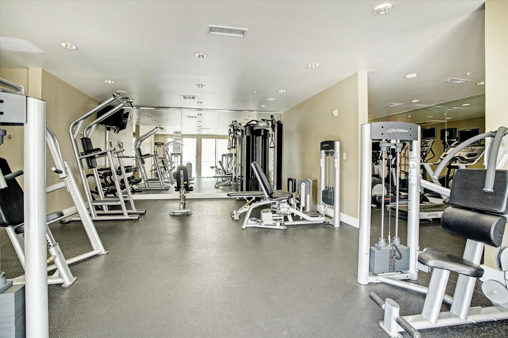 3505 Sage Road, Unit 1106 Houston, TX 77056 - Photo 18 of 22 Featuring a selection of modern cardio machines, strength-training equipment, and free weights, the gym provides everything needed for a comprehensive workout just steps from home.