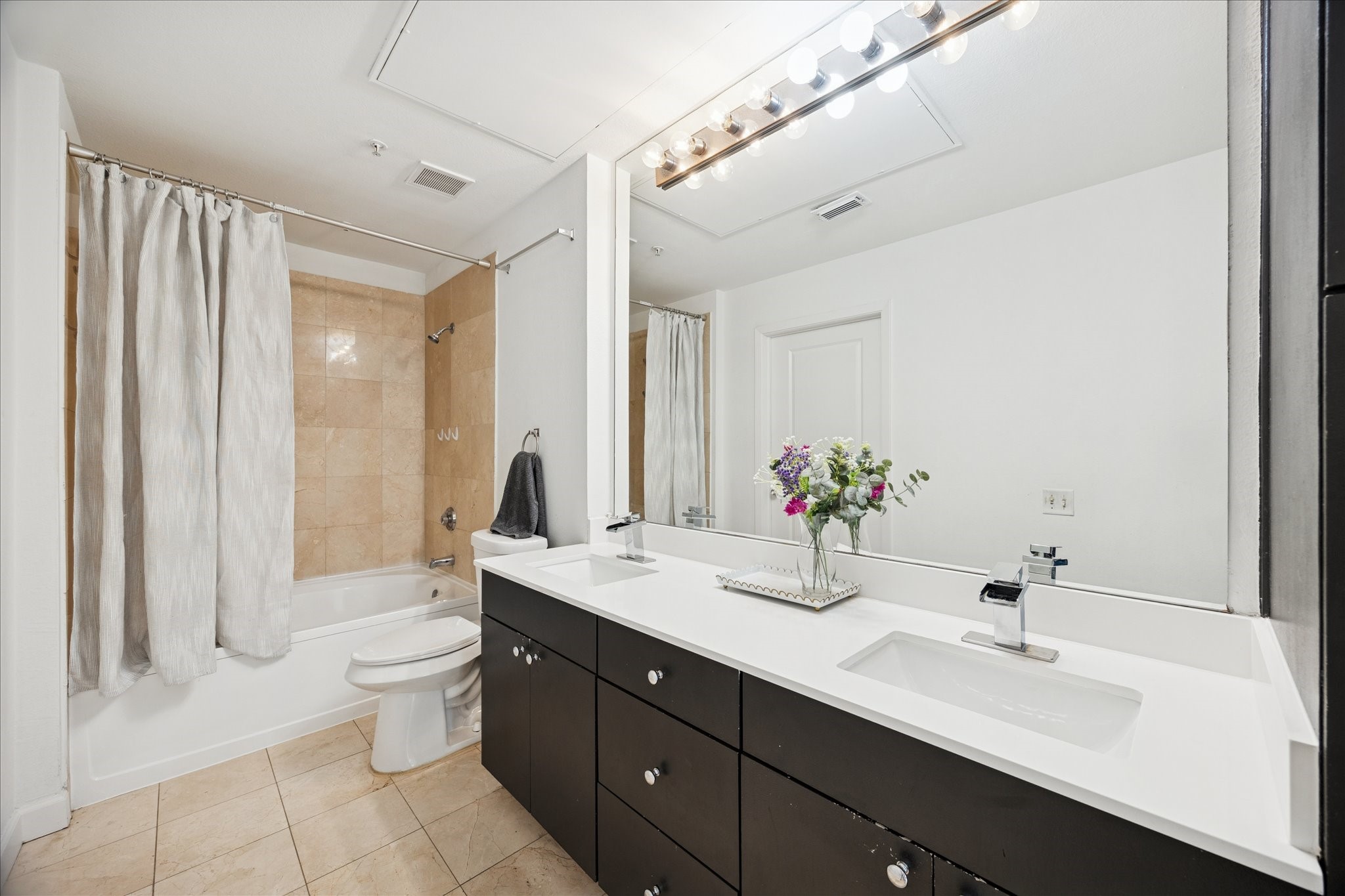 3505 Sage Road, Unit 1106 Houston, TX 77056 - Photo 10 of 22 Thoughtfully selected materials and streamlined details create a spa-inspired atmosphere that feels both elegant and effortlessly functional.