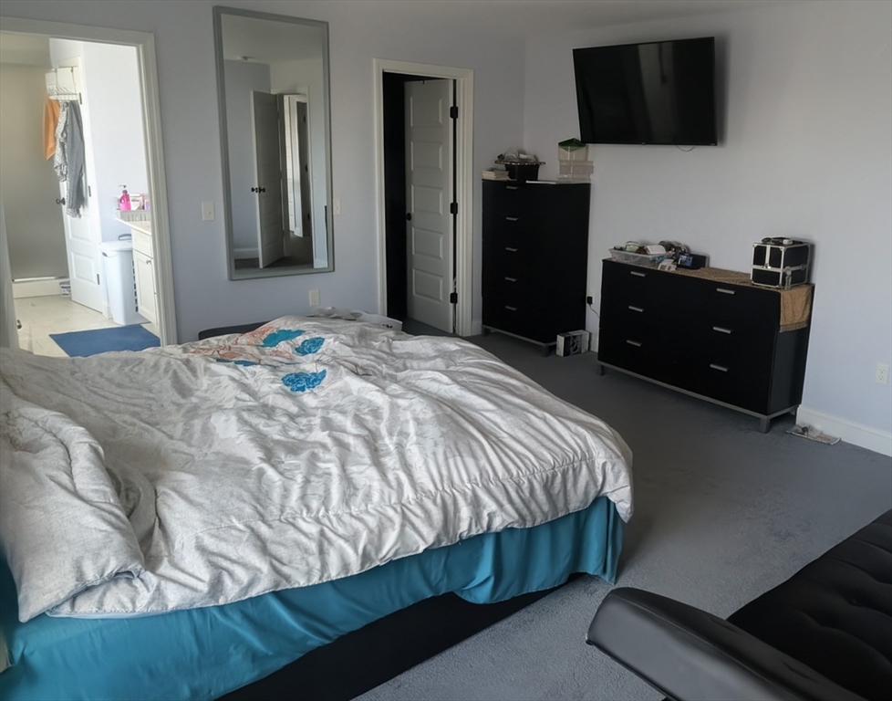 456 Ridge Road Athol, MA 01331 - Photo 15 of 26 a bedroom with a bed and flat screen tv