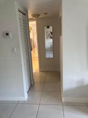 a bedroom with a bed and a table