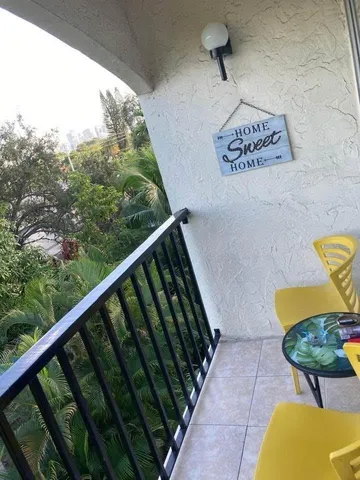a view of roof deck with furniture