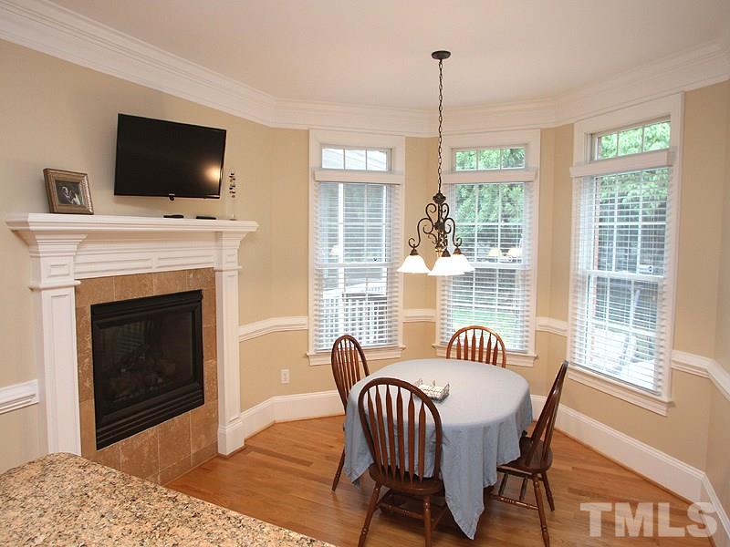 3710 Congeniality Way Raleigh, NC 27613 - Photo 7 of 23 Enjoy the view out the bay window or a cup of coffee next to the two-way fireplace.