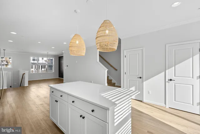 a spacious bathroom with a sink a mirror and a window