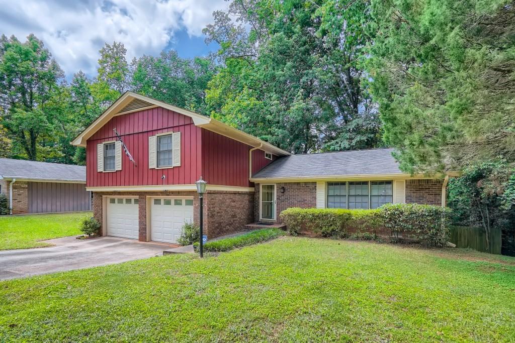 3826 Bretton Woods Road Decatur, GA 30032 - Photo 1 of 1 a view of a yard in front of a house with large windows