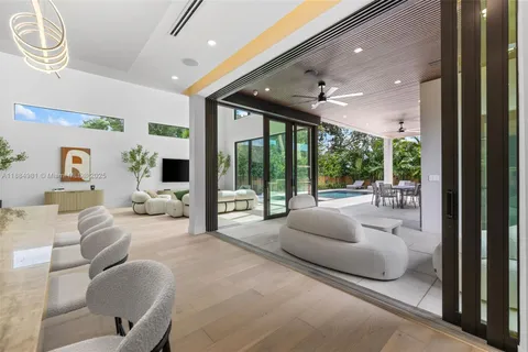 a spacious bedroom with two large bed and a large window