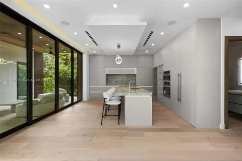 a bedroom with a large bed and a large window