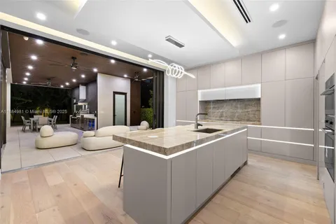 a bedroom with a large bed and a large window