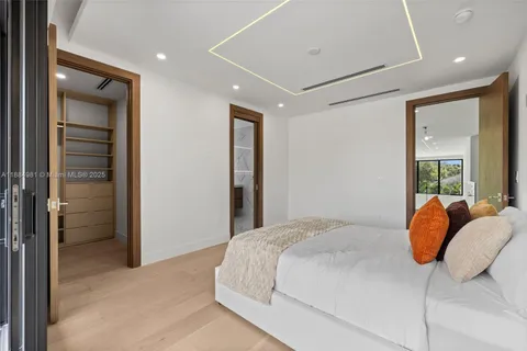 a view of a backyard with pool table and chairs
