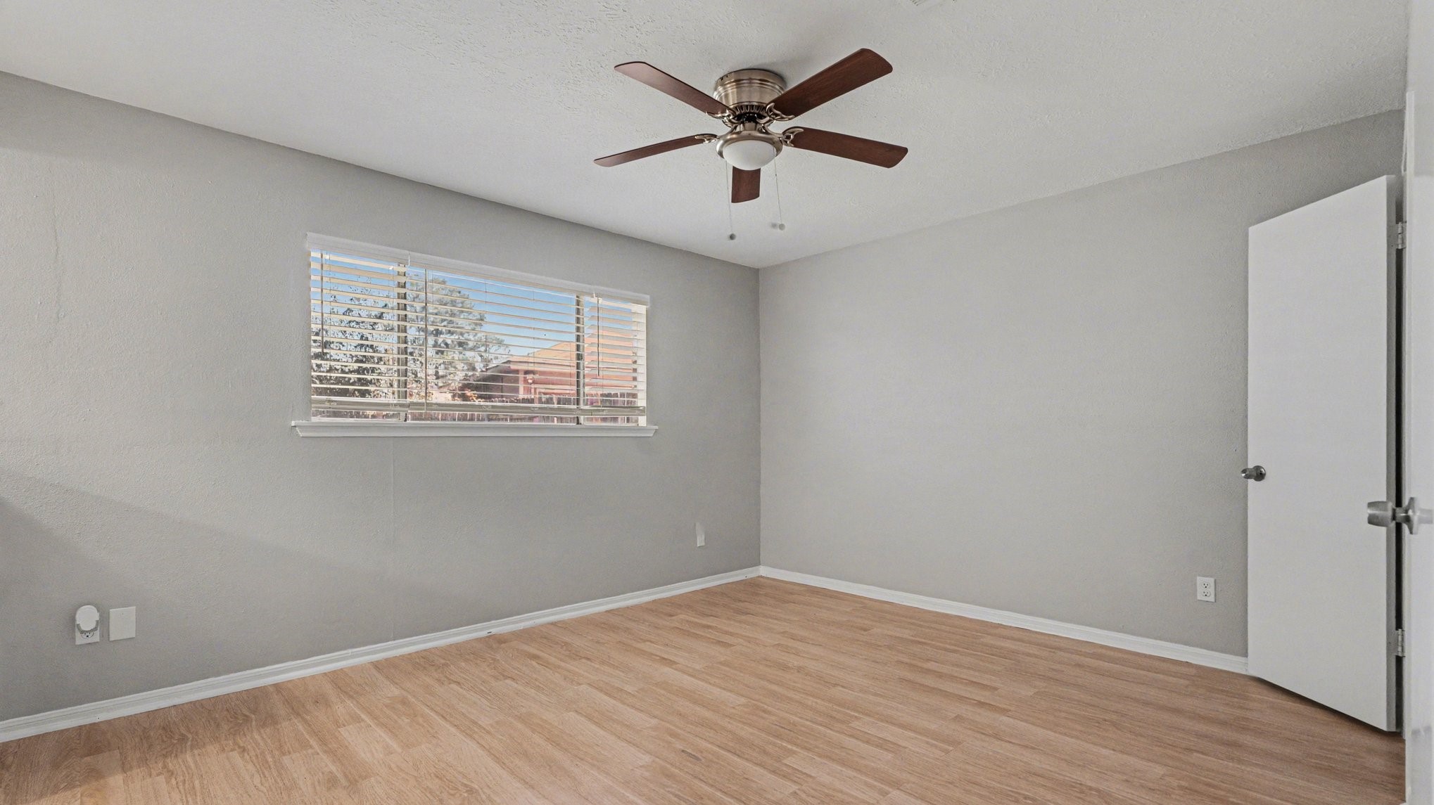 23210 Earlmist Drive Spring, TX 77373 - Photo 14 of 22 an empty room with wooden floor and ceiling fan