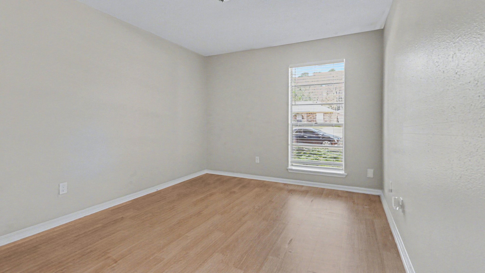 23210 Earlmist Drive Spring, TX 77373 - Photo 20 of 22 a view of an empty room with wooden floor and a window