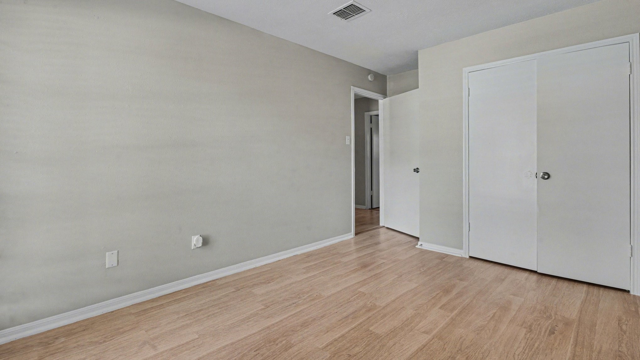 23210 Earlmist Drive Spring, TX 77373 - Photo 21 of 22 a view of an empty room with wooden floor