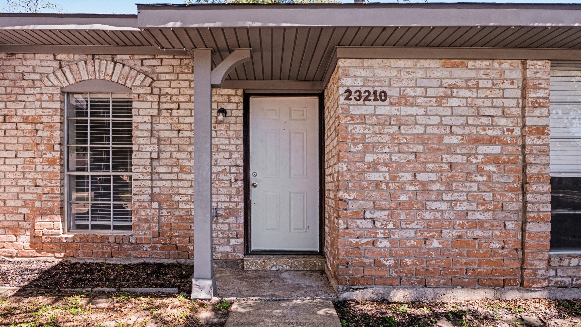 23210 Earlmist Drive Spring, TX 77373 - Photo 4 of 22 a view of a door and brick wall
