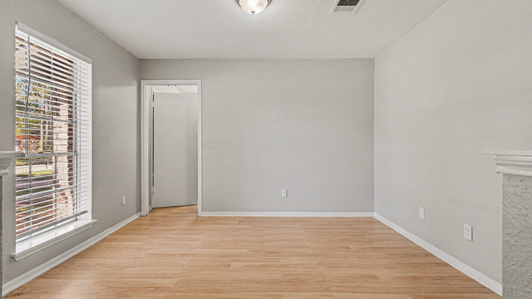 23210 Earlmist Drive Spring, TX 77373 - Photo 5 of 22 a view of empty room with wooden floor