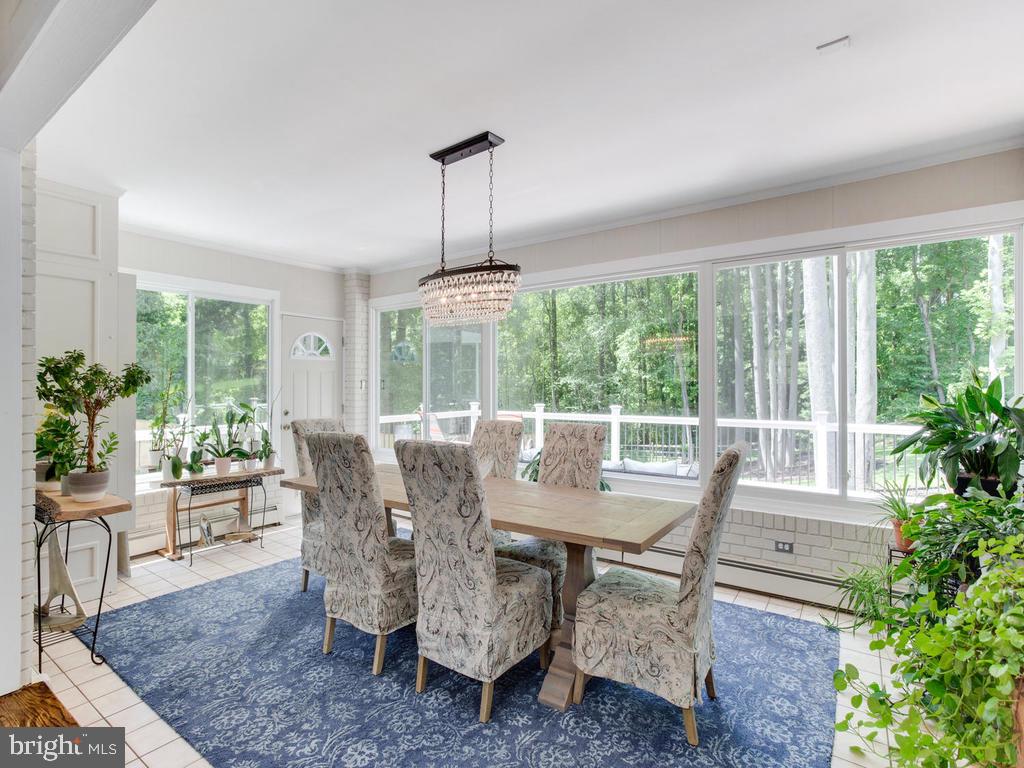 6678 Old Solomons Island Road Friendship, MD 20758 - Photo 22 of 57 a view of a dining room with furniture window and outside view