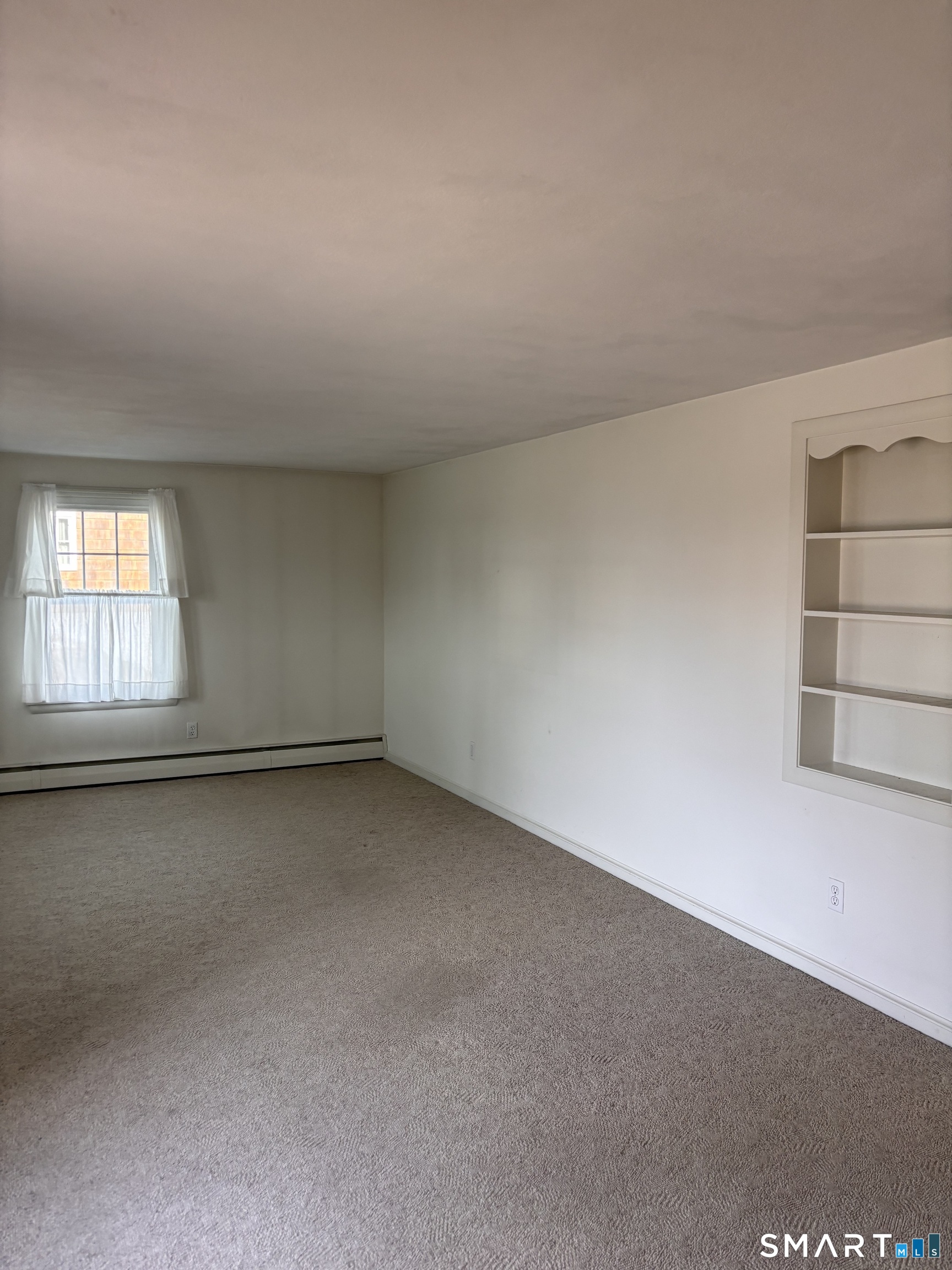 28 Bayberry Lane Groton, CT 06340 - Photo 4 of 17 an empty room with a window