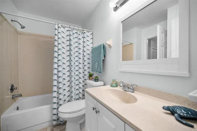 a view of an empty room and a window