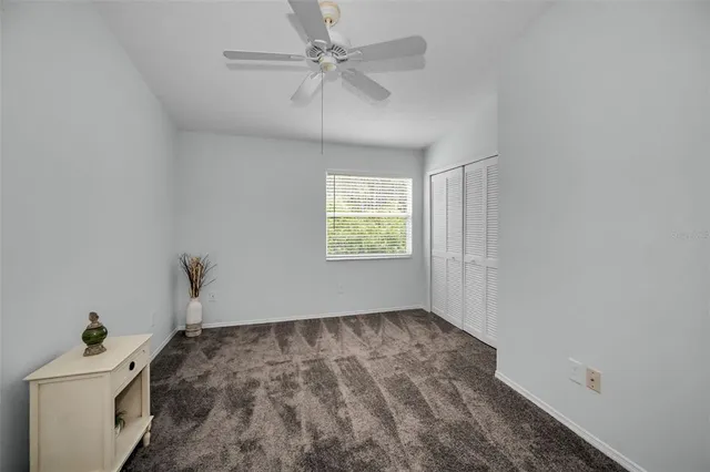a view of a livingroom with a chandelier fan