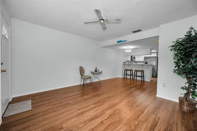a view of a livingroom with furniture and wooden floor