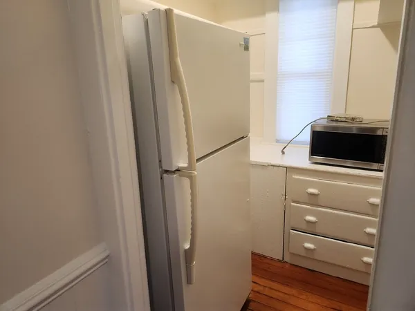 a bathroom with a shower and a sink