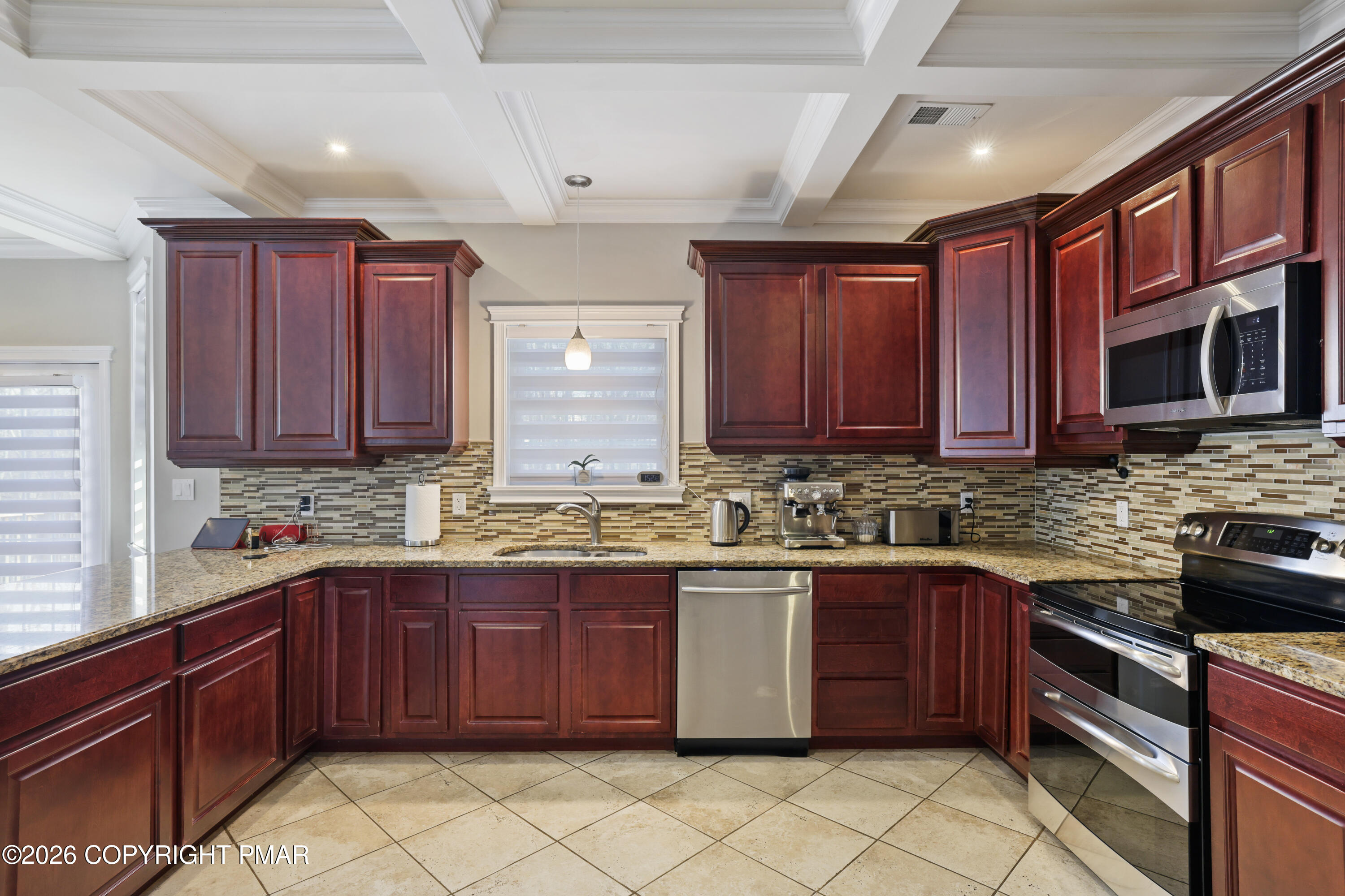 117 Fernwood Road Bushkill, PA 18324 - Photo 15 of 65 a kitchen with stainless steel appliances granite countertop wooden cabinets stove top oven and sink
