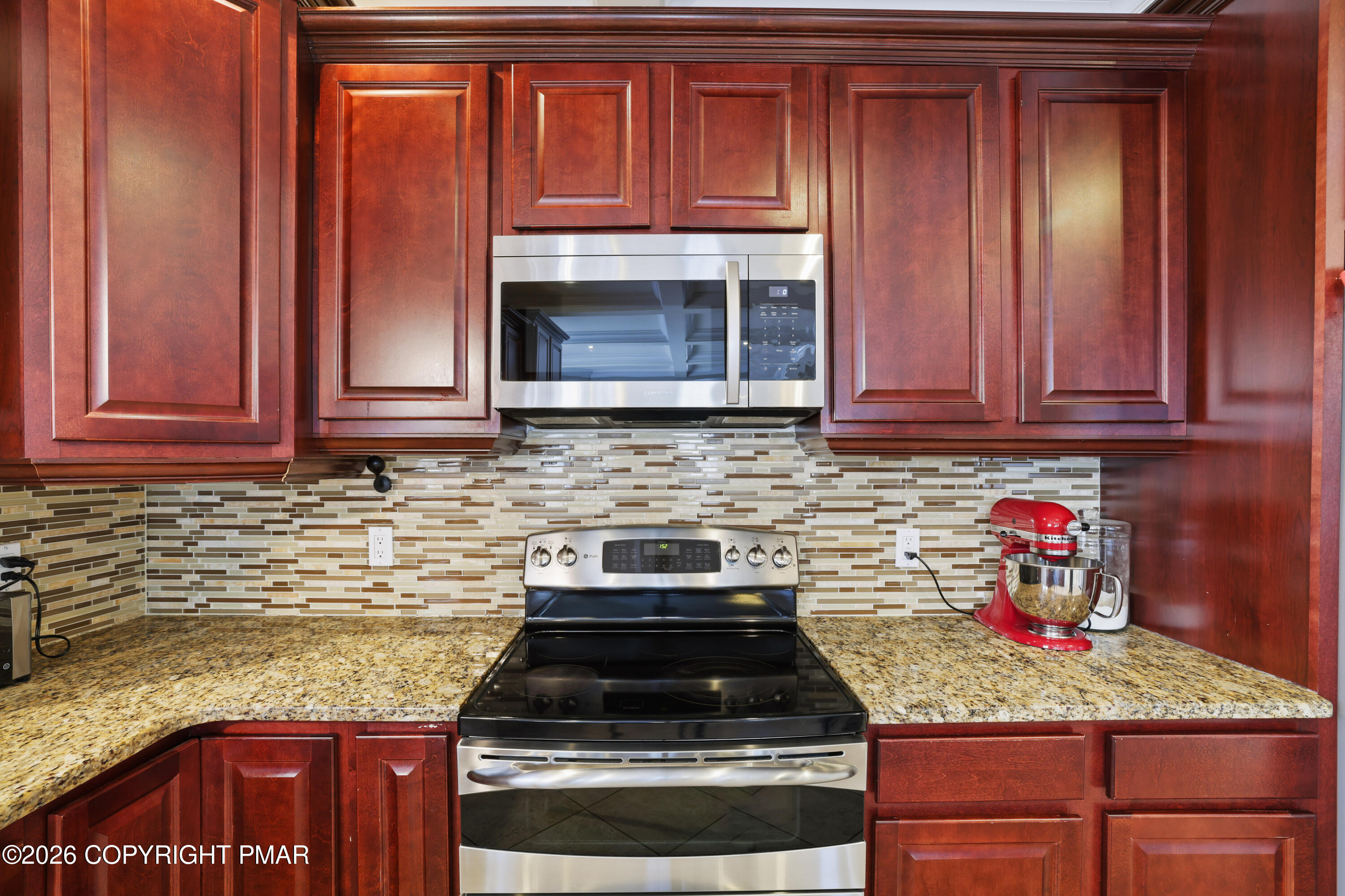 117 Fernwood Road Bushkill, PA 18324 - Photo 18 of 65 a kitchen with granite countertop cabinets and stainless steel appliances