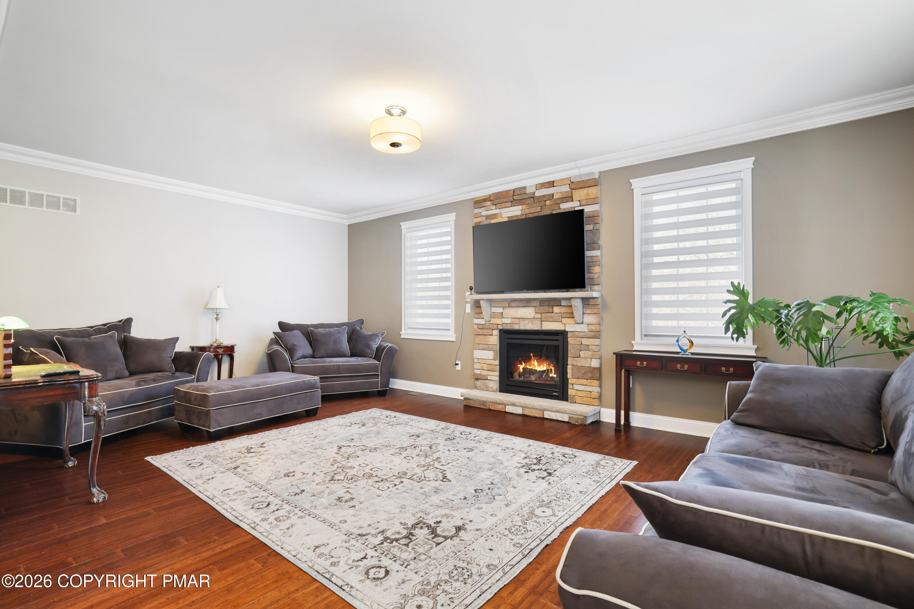 117 Fernwood Road Bushkill, PA 18324 - Photo 2 of 65 a living room with furniture and a fireplace