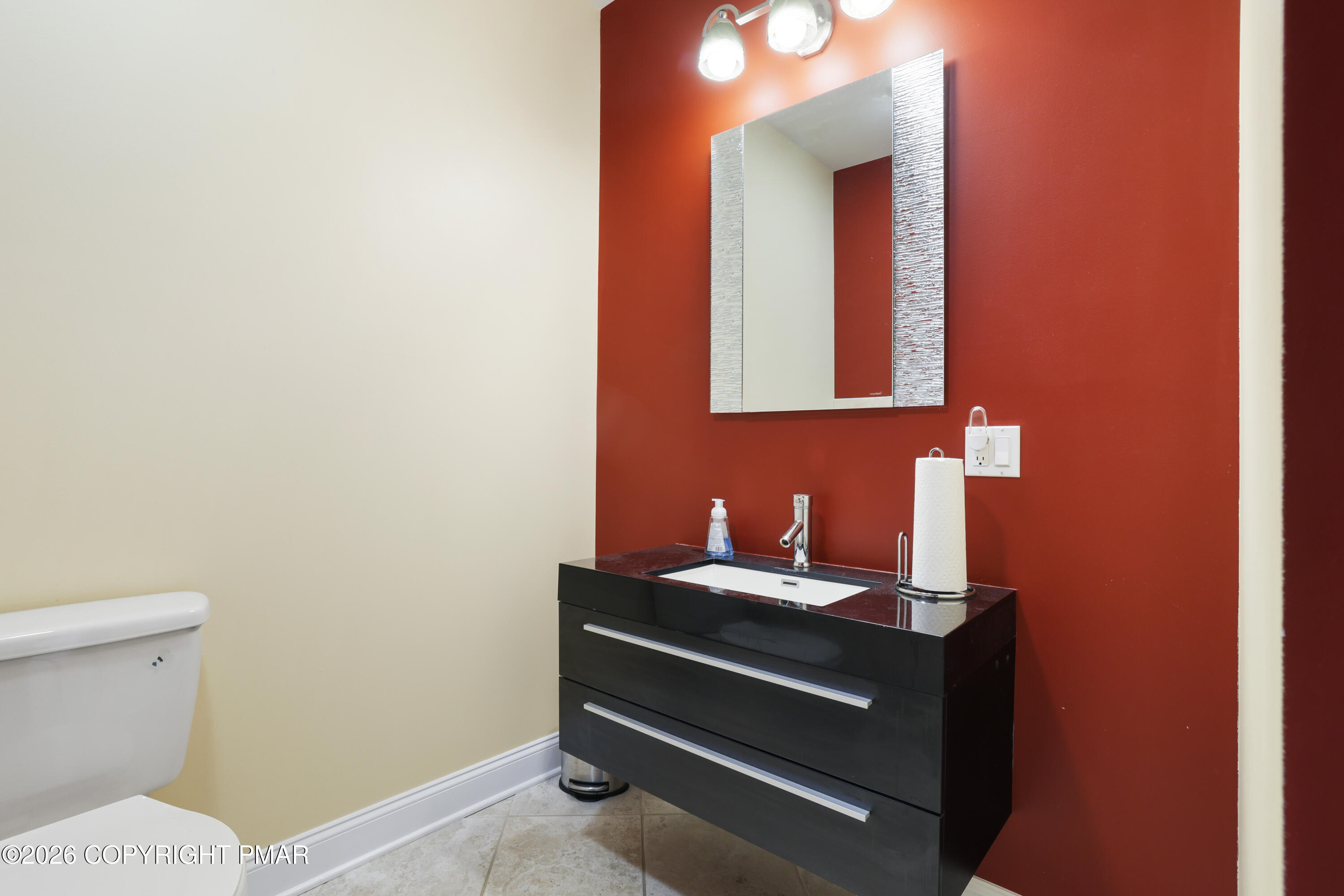 117 Fernwood Road Bushkill, PA 18324 - Photo 26 of 65 a bathroom with a toilet a sink and mirror
