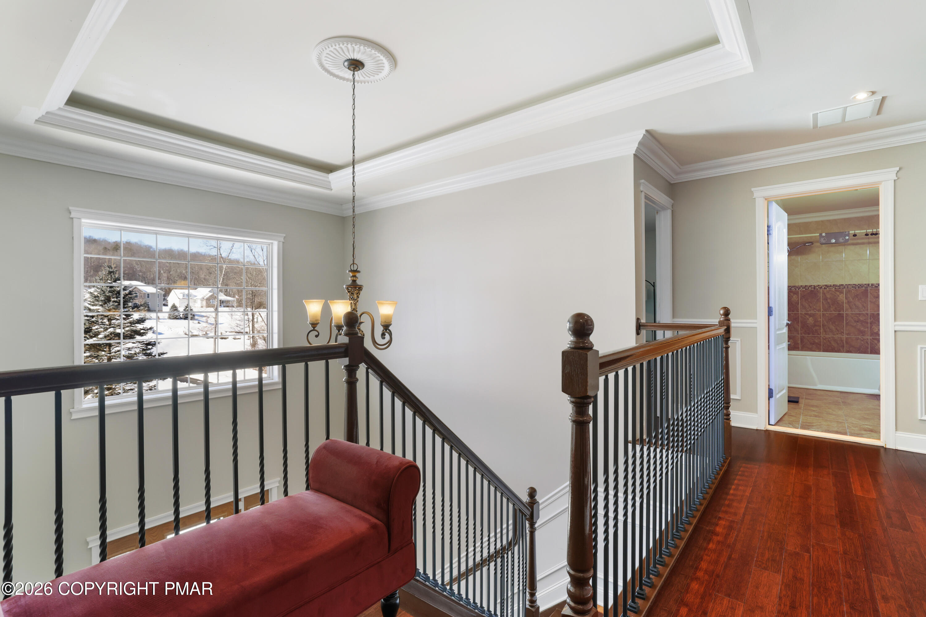 117 Fernwood Road Bushkill, PA 18324 - Photo 30 of 65 a view of a hallway with wooden floor and windows