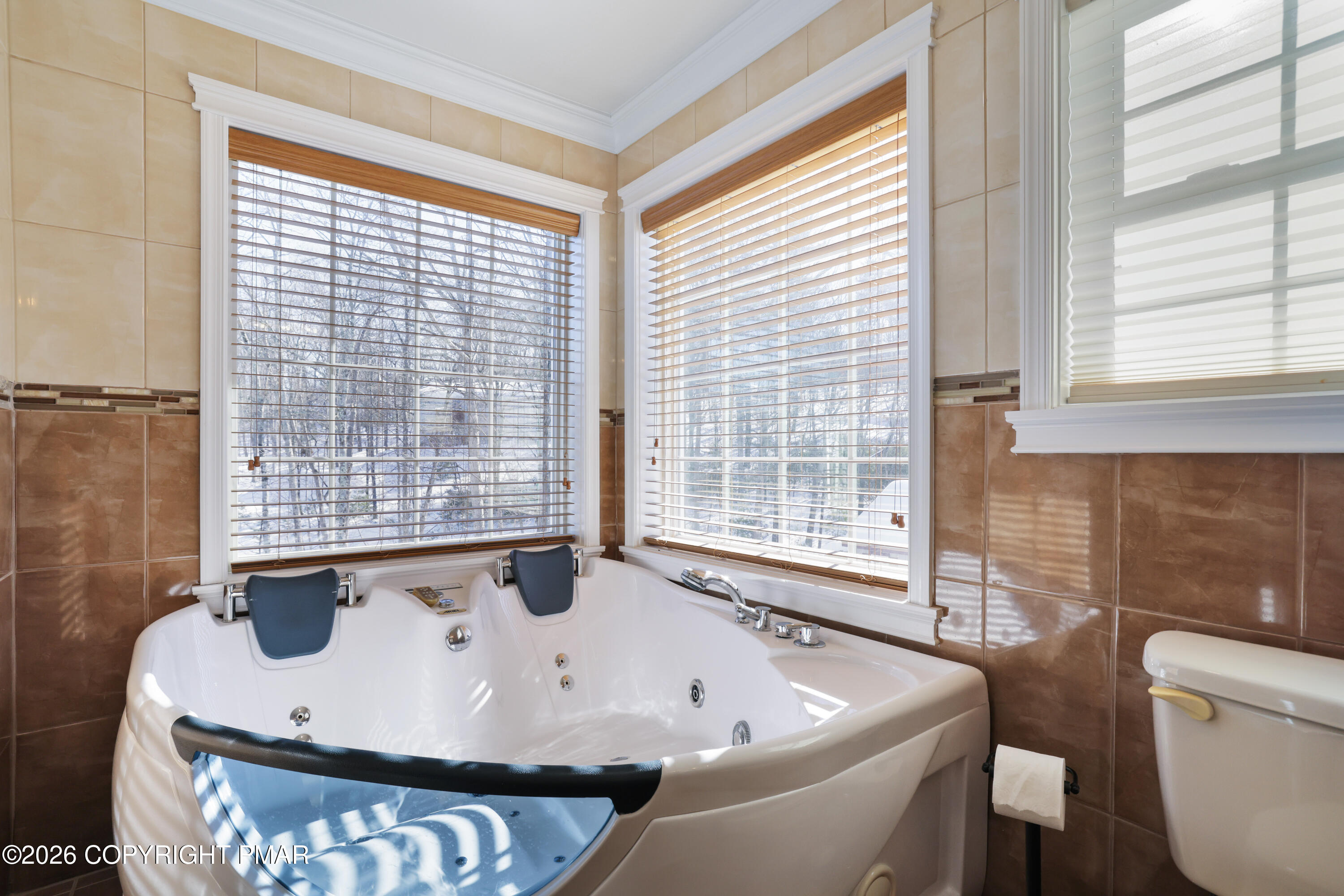 117 Fernwood Road Bushkill, PA 18324 - Photo 34 of 65 a bath tub sitting in a bathroom next to a window