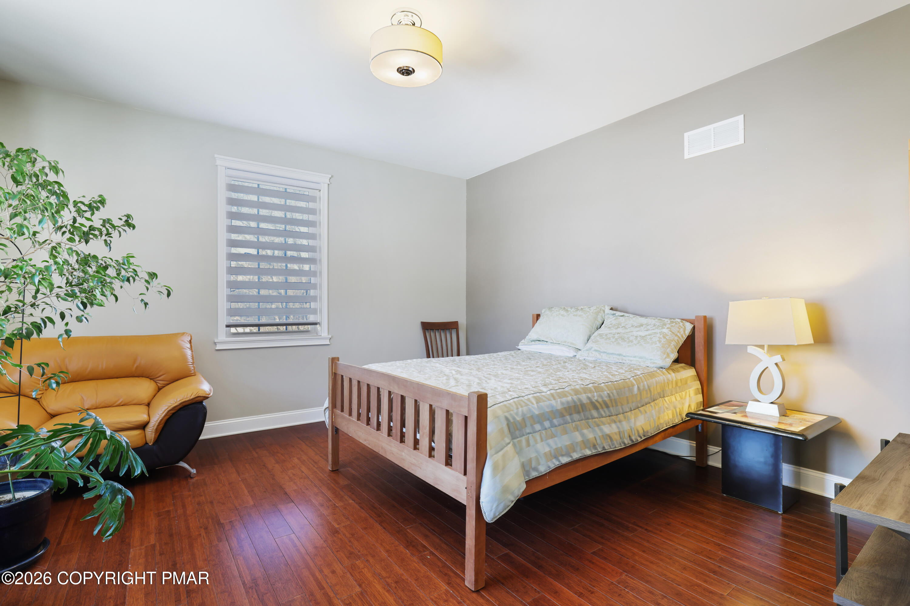 117 Fernwood Road Bushkill, PA 18324 - Photo 38 of 65 a bedroom with a bed and a potted plant