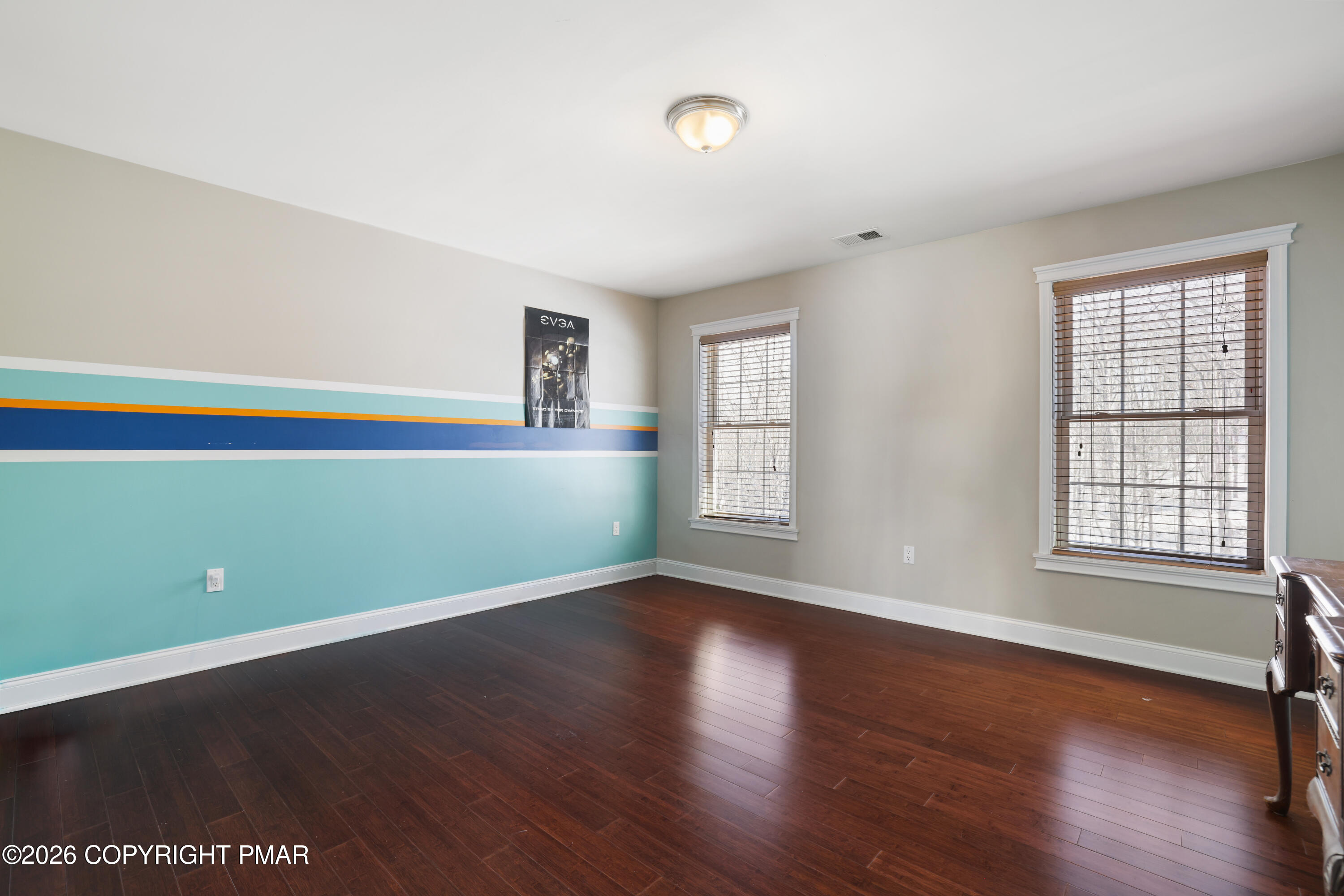 117 Fernwood Road Bushkill, PA 18324 - Photo 43 of 65 an empty room with wooden floor and windows