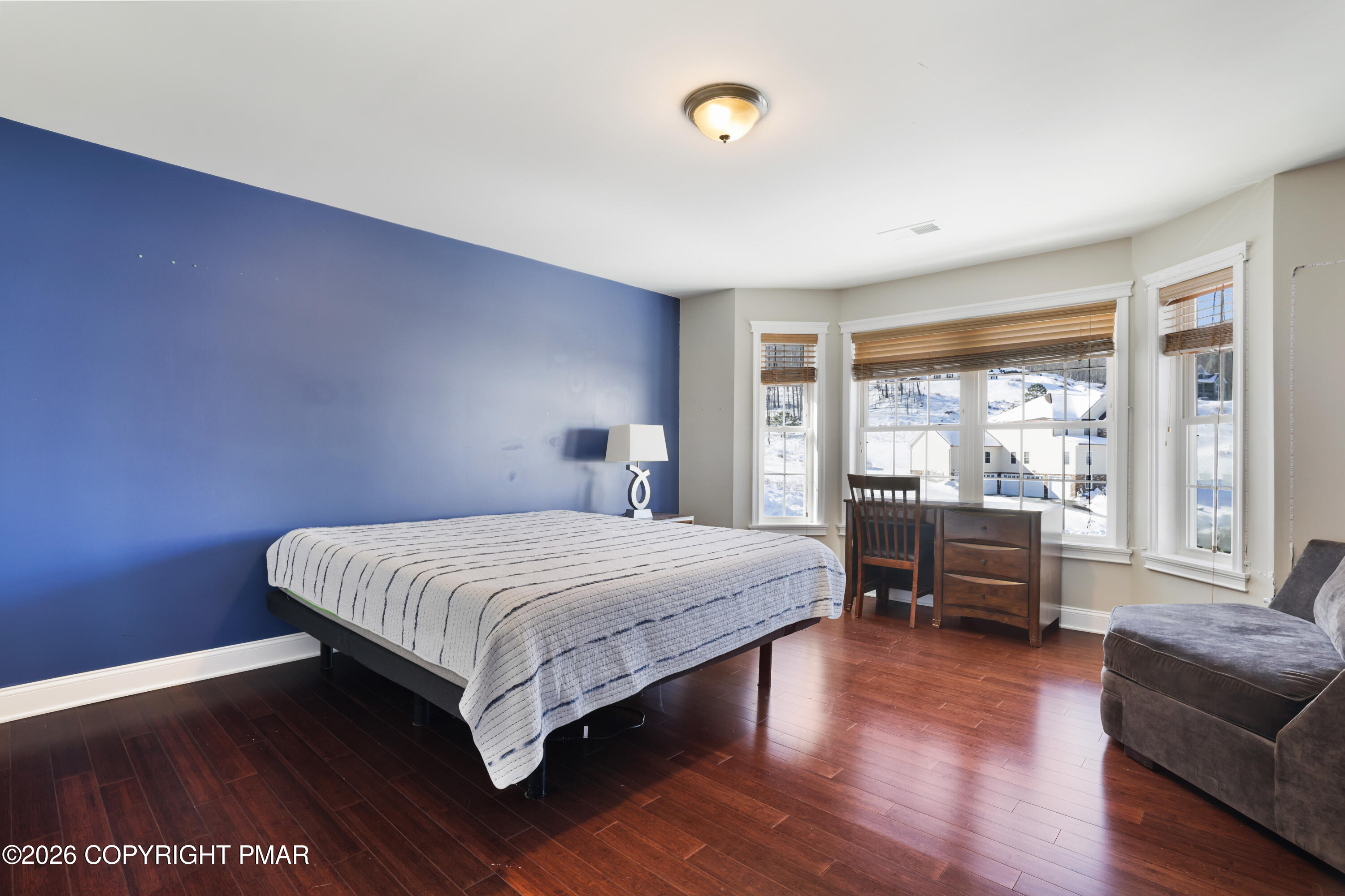 117 Fernwood Road Bushkill, PA 18324 - Photo 44 of 65 a bedroom with a bed and wooden floor