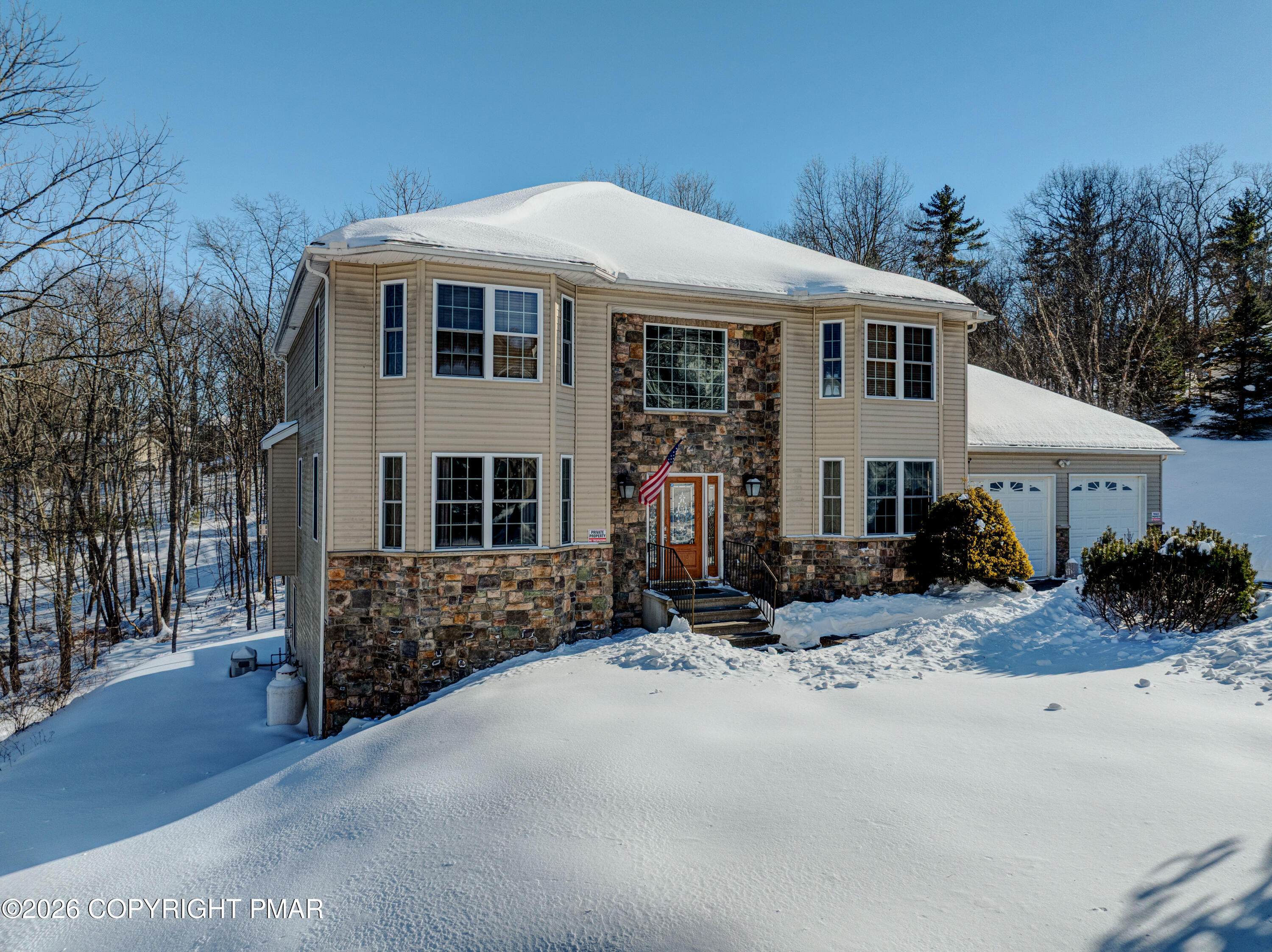 117 Fernwood Road Bushkill, PA 18324 - Photo 65 of 65 a view of a house with a yard covered in snow