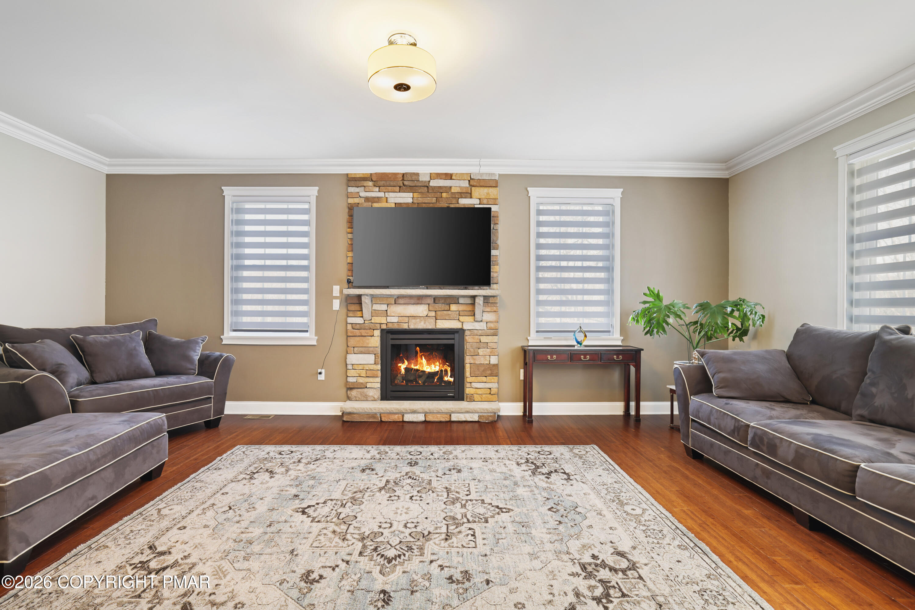 117 Fernwood Road Bushkill, PA 18324 - Photo 10 of 65 a living room with furniture and a fireplace