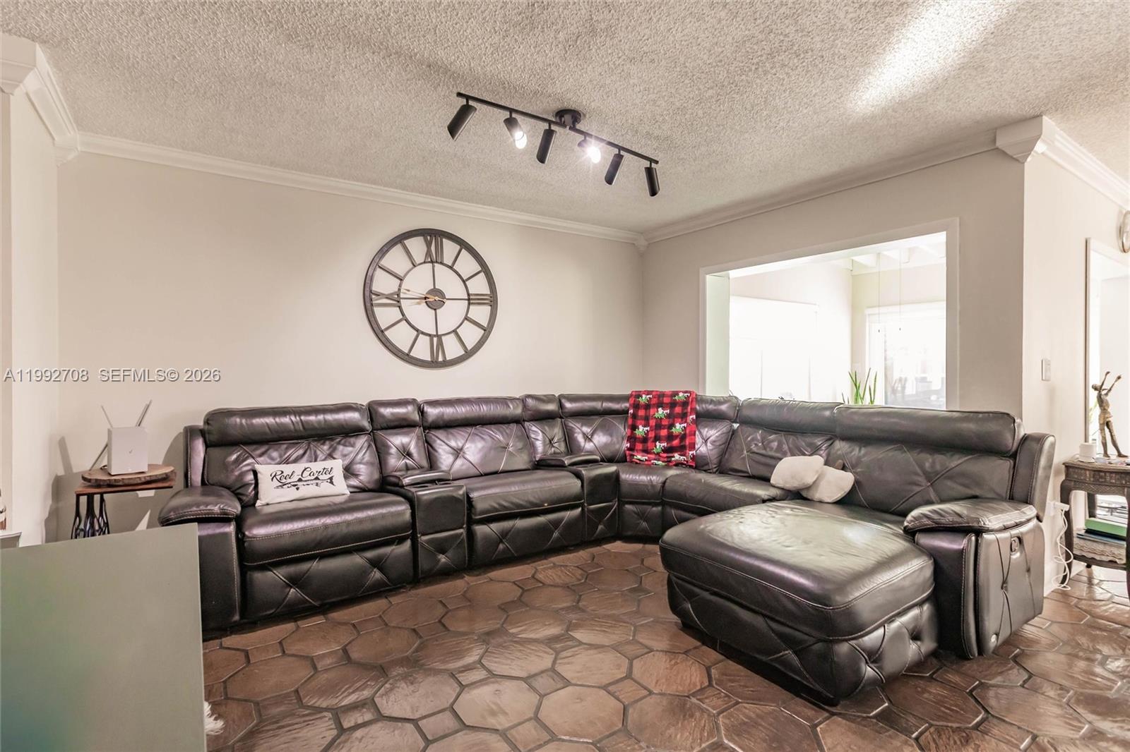 9404 Southwest 8th Terrace, Unit 9404 Miami, FL 33174 - Photo 13 of 41 a living room with furniture and a large window